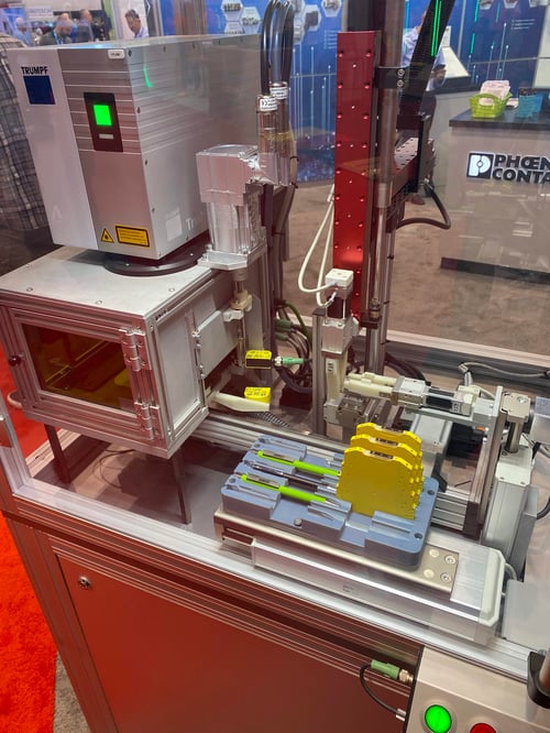 An automated manufacturing cell seen at IMTS 2022 to laser mark power distribution blocks